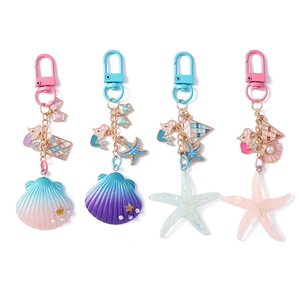 Ocean theme keychain set with gradient shell and starfish charms on a clean white background