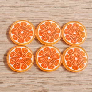 Flat lay macro of six bright orange resin slices with pulp texture on wood