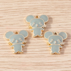 Detail view of mint green mouse alloy charms with gold edges and top hanging holes
