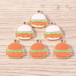 Creative alloy burger charms set for DIY jewelry making on a light wooden background