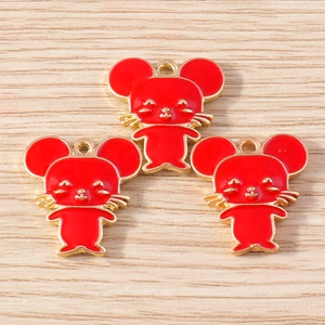 Detailed close-up of three red enamel mouse pendants with gold-plated metal base for DIY