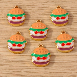 Detail of 6 mini enamel hamburger charms for DIY jewelry making on a wood background