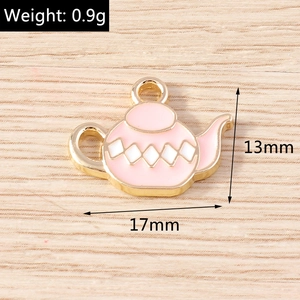 Pink enamel teapot charm with gold trim and white diamond pattern, 17mm size detail view