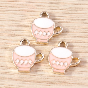 Detailed view of three pink teapot enamel charms with gold plating for DIY jewelry making