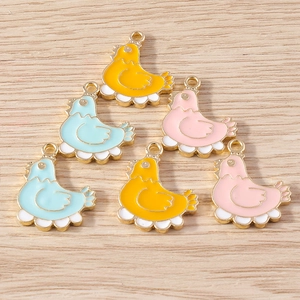 Detailed view of colorful cartoon hen charms in yellow, pink and blue enamel alloy