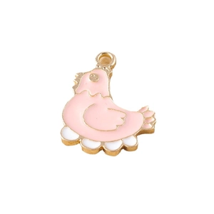 Cartoon hen laying egg pendant charms in gold alloy with pink and white enamel details