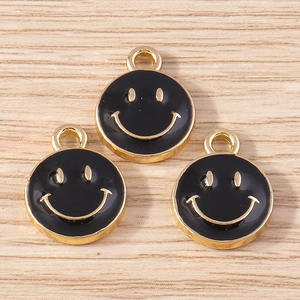 Three black enamel smiley face charms with golden details for DIY jewelry making crafts