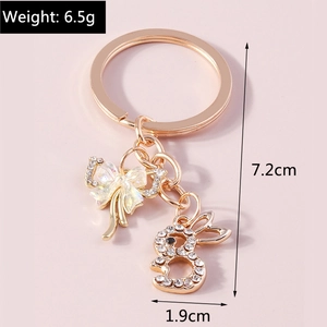 Golden metal bunny keychain with rhinestone bow pendant for bag decoration and phone charm