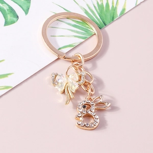 Cartoon animal keychain with a colorful bow and sparkling rhinestone rabbit pendant