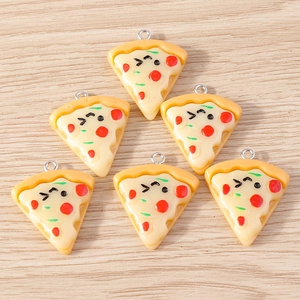Macro detail of cartoon pizza charms with cute faces and silver metal hanging loops