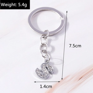 Detail showing letter S keychain dimensions 7.5cm height and 5.4g weight with rhinestones