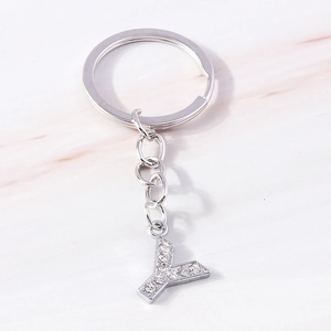 Close-up of a silver-toned keychain featuring letter Y pendant with sparkly rhinestones