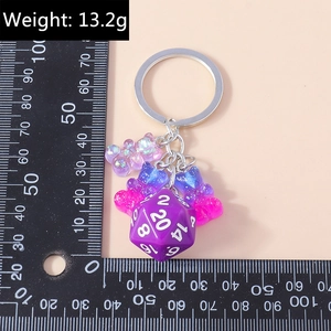 Detail showing creative purple D20 dice and colorful resin bears keychain with 13.2g weight