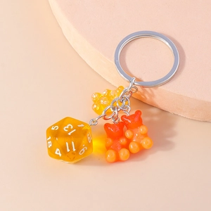 Creative bear gummy keychain with yellow transparent d20 dice and silver metal clip