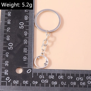 Classic vintage crescent moon face keychain in antique silver alloy with star pendant