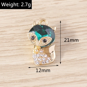 Detail of fox pendant with green gemstone and white zircons, size 21x12mm, weight 2.7g