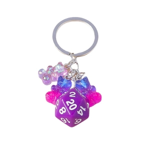 Cute cartoon bear keychain with purple gradient gummy bears and a D20 gaming dice