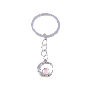 Futuristic silver moon keychain with iridescent bead and diamond accents on white background