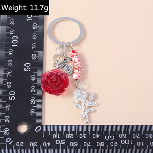 Creative rose flower keychain with red resin pendant and silver leaves, weight 11.7g