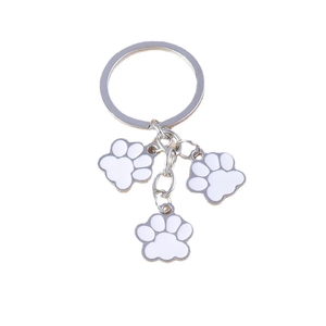 Porte-clés créatif en métal avec trois adorables empreintes de pattes en émail blanc