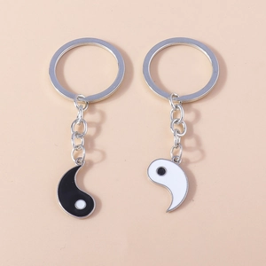 Creative Tai Chi Yin Yang couple keychain set with black and white enamel pendants