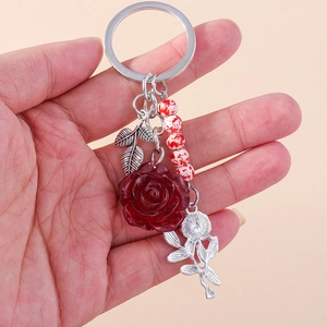 Elegant deep red resin rose keychain with silver leaf and decorative splatter beads
