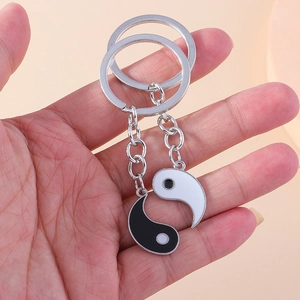 Creative Tai Chi Yin Yang couple keychains in polished metal with black and white enamel finish