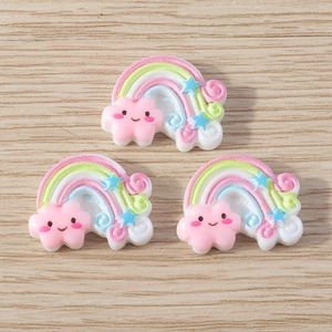 Detailed view of resin rainbow cloud charms with glitter finish for DIY jewelry crafts