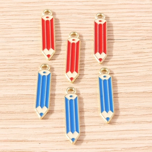 Detail view of pencil-shaped enamel pendants in red and blue for DIY jewelry crafts