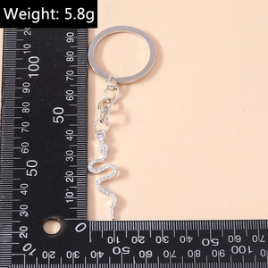 Detailed view of creative diamond snake keychain accessory with measurement ruler and weight