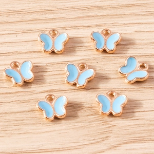 Detailed view of sky blue enamel butterfly charms with rose gold alloy plating for DIY crafts