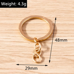 Detail view of golden alloy flat key ring with dimensions 29mm and weight 4.3g