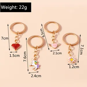 Size chart showing dimensions for heart, unicorn, wings, and daisy keychain charms