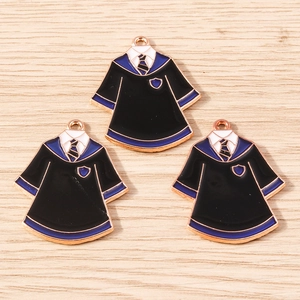 Macro detail of academic uniform charms featuring enamel ties and collegiate emblems