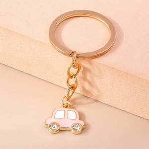 Porte-clés voiture rose mignon avec roues en cristal et placage d'or pour sac