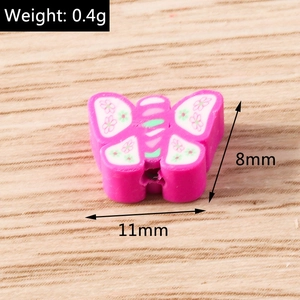 Macro shot of pink butterfly polymer clay beads showing size 11mm by 8mm for DIY jewelry