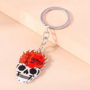 Porte-clés crâne en flammes avec petit diable rouge en acrylique et chaîne en métal