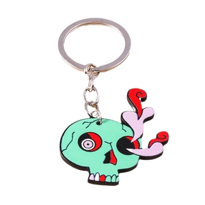 Porte-clés crâne de zombie vert cartoon avec yeux colorés et design punk artistique