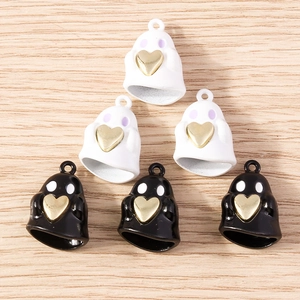 Detailed view of Halloween ghost charms with gold hearts for DIY jewelry making