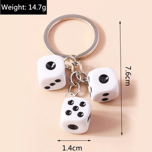 Detailed view of white acrylic dice keychain with 14.7g weight and 7.6cm length