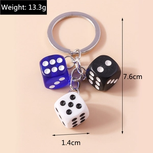 Detail showing acrylic dice keychain dimensions with blue, black and white cubes