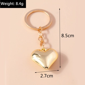 Dimensioni portachiavi a cuore dorato lucido con altezza 8,5cm e peso di 8,4g dettagli