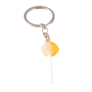 Vibrant yellow swirl lollipop keychain charm with a sturdy silver metal keyring