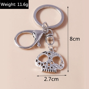 Detailed view of silver hollow skull keychain with lobster clasp and size measurements