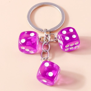 Detail view of purple transparent acrylic dice keychain with silver metal ring and chain
