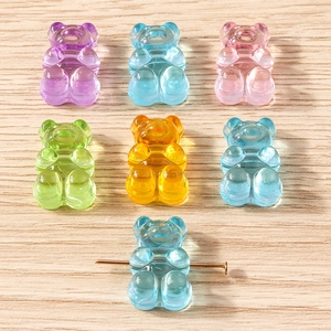 Detailed view of colorful translucent resin bear charms with pre-drilled metal pins
