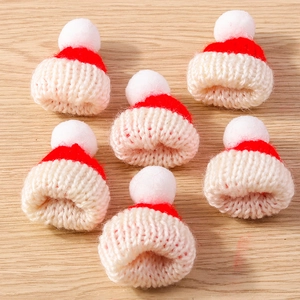 Set of 6 mini knitted red and white Christmas hats for DIY crafts and holiday decor