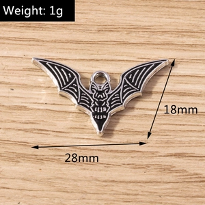 Detailed view of a black bat charm pendant with size dimensions 28mm by 18mm