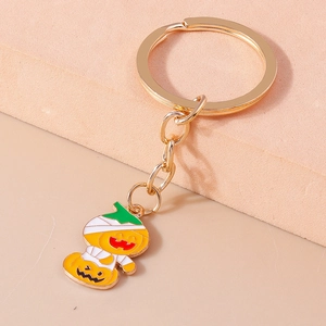 Cartoon pumpkin mummy keychain in gold metal with colorful enamel for Halloween