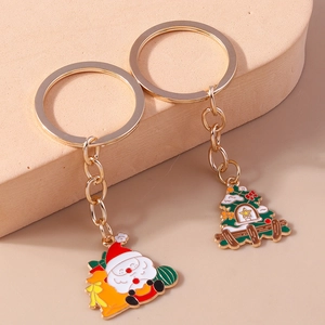 Christmas keychain set with Santa Claus and tree charms in golden alloy finish